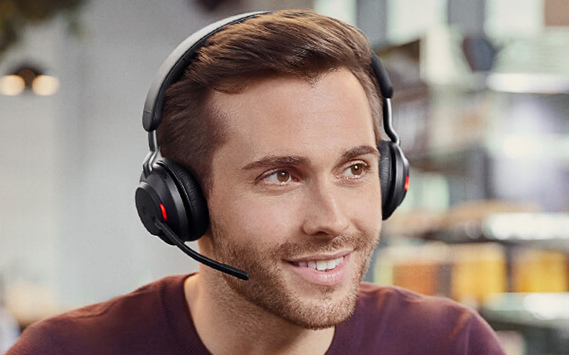 Smiling man wearing Evolve headset