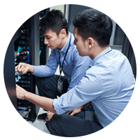 Two IT engineers working in data center