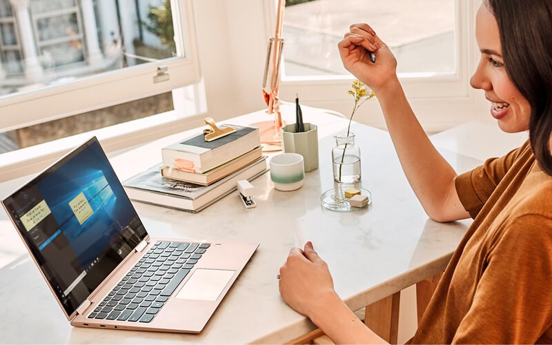 Woman using laptop with Microsoft Windows 10