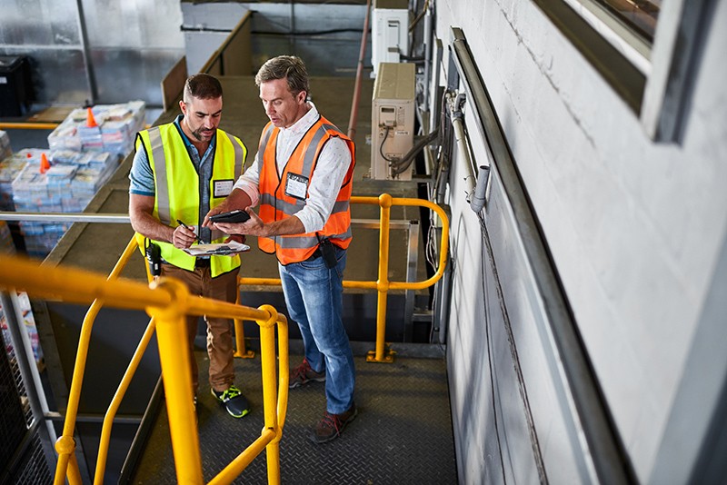 Warehouse managers track clients product from tablet computer