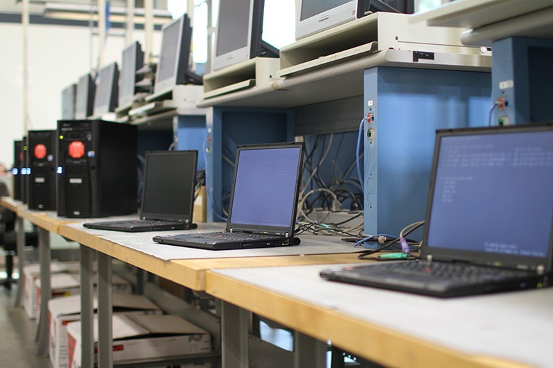 Desktop and laptop computers on integration lab bench to be updated
