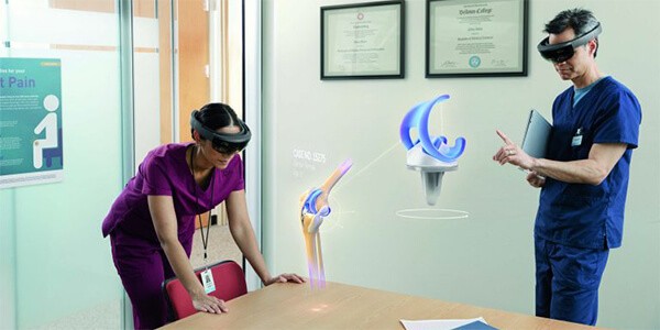 Medical professional using a Microsoft HoloLens to project a medical procedure