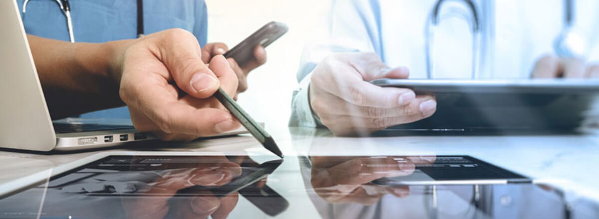 Client story Healthcare Data Provider Adopts Fast, Scalable Cloud-Based Data Warehouse Two doctors using laptops and tablet devices