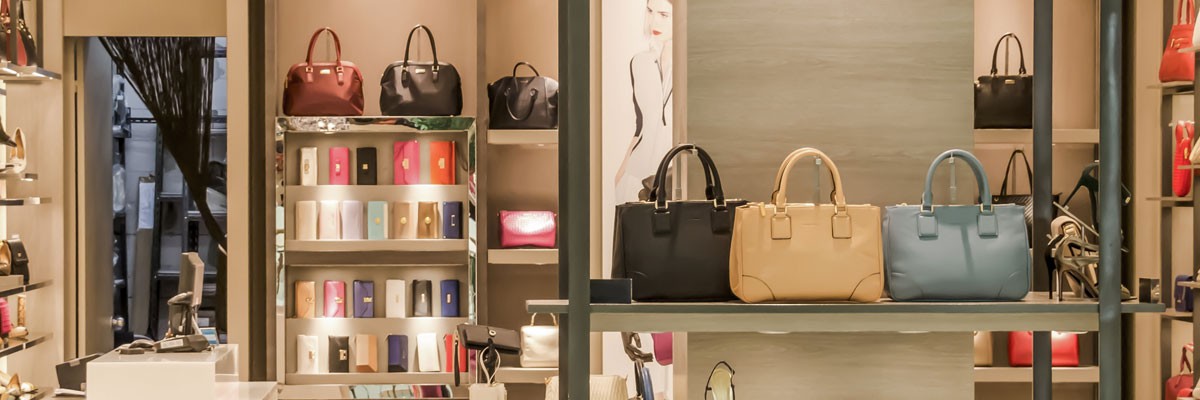 Close up of store shelves with purses 