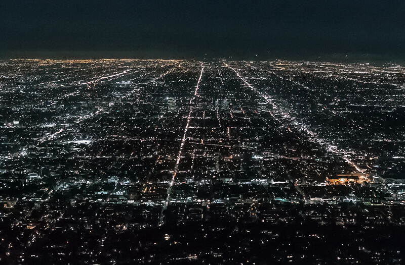 Pioneering a secure urban future City skyline at night, aerial metropolis twilight, urban resilience, smart city lights, sprawling city aerial.