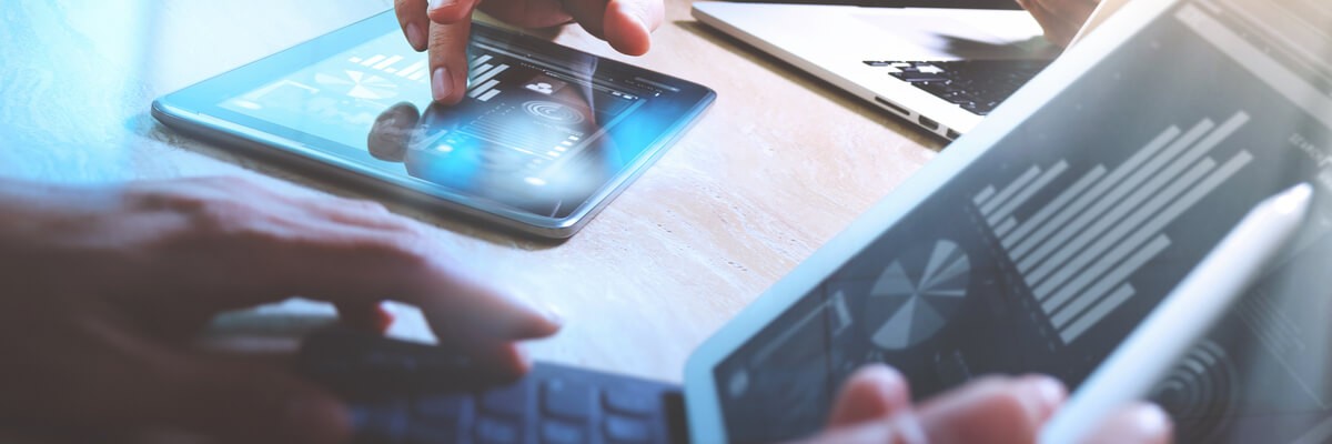 National Financial Credit Union Reduces Rapid Server Provisioning From Three Weeks To Thirty Minutes Close up of financial information on devices