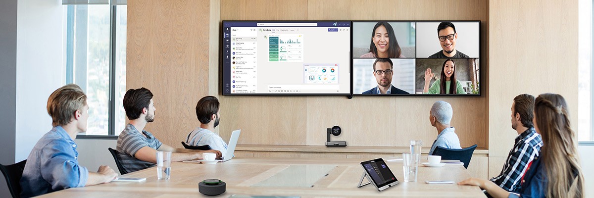 Users in conference room using Yealink video conferencing tools 