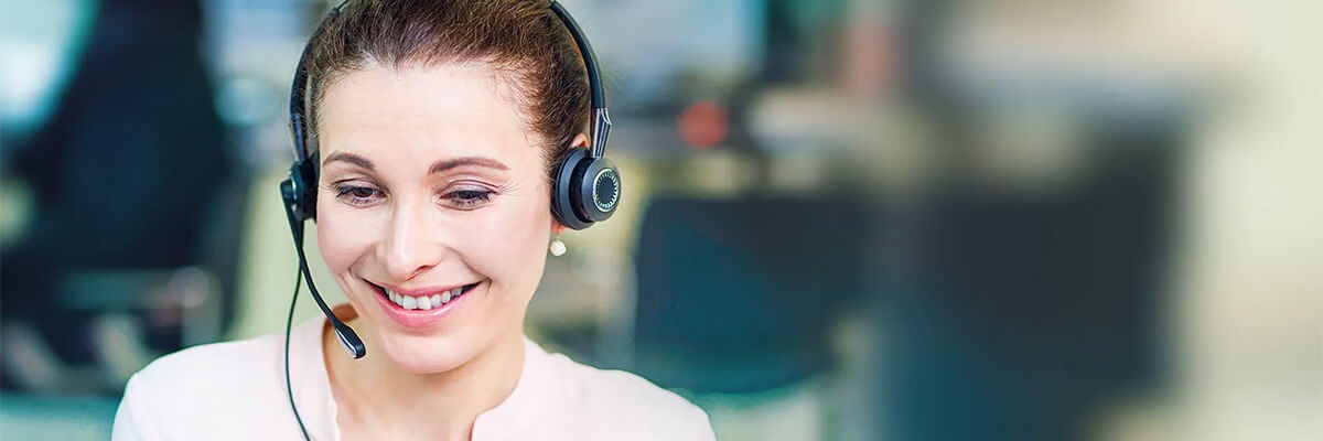 Customer care representative on call with client using Jabra Biz series headset