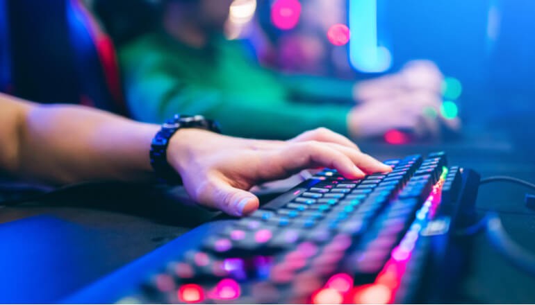 User in esports typing on keyboard
