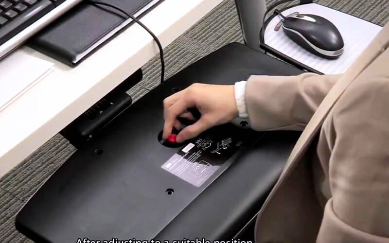Man using 3M Adjustable Keyboard Tray