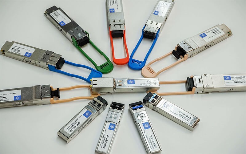 Specialist in optical transceivers Two military Personnel walking on a server room