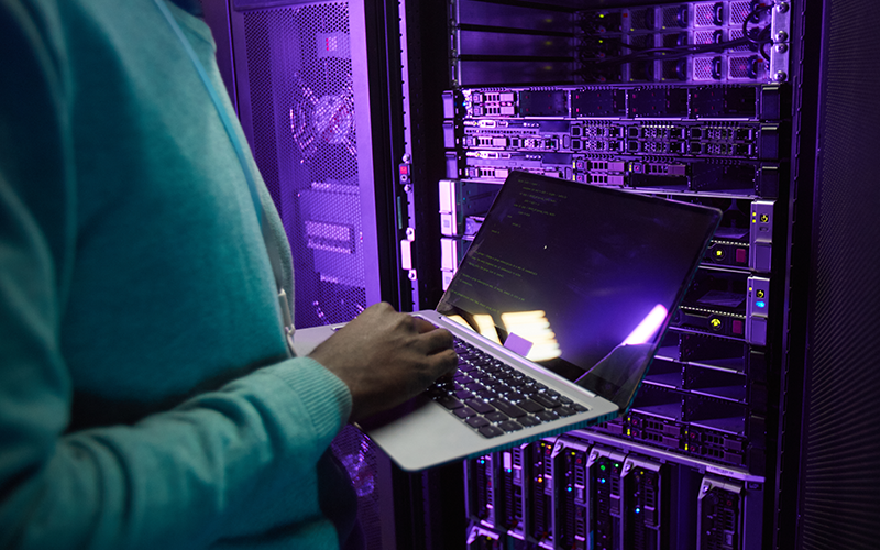 Avigilon solutions seamlessly integrate across your video security system Professional working on a data center