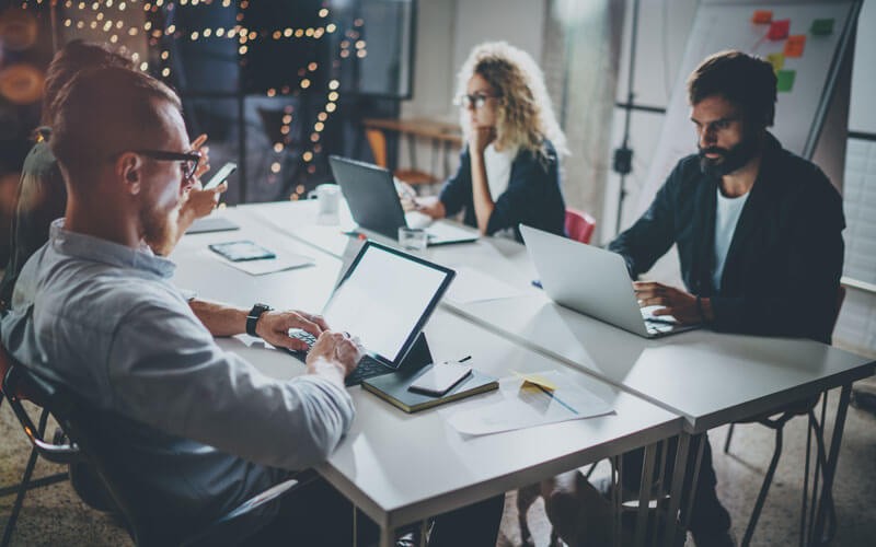 MigrationWiz Public Folder Migration Team working in office