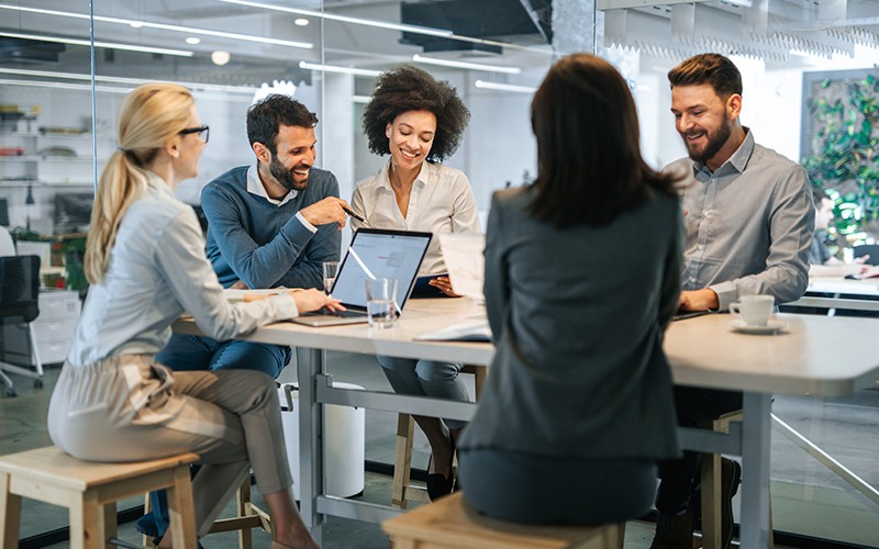 Architectures that suit your business needs. Conference room with people video conferencing.