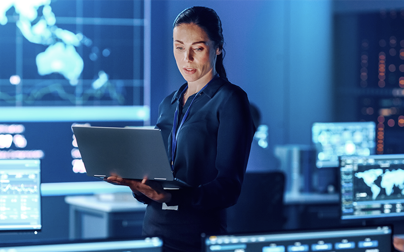 Female employee using laptop