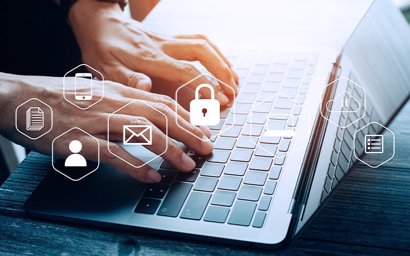 Gitlab Ultimate Person using a laptop with security icon and more