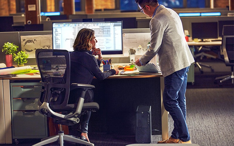 HP workstations Business man working on HP monitor and workstation