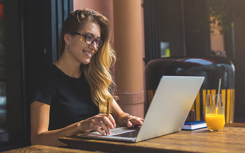 Improve the end-user experience. Woman working using a laptop