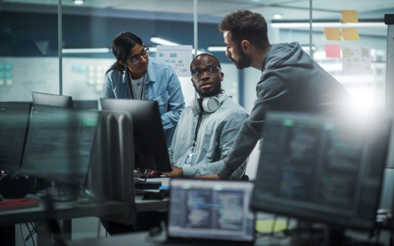 Take advantage of cloud management tools that optimize performance View of business professionals collaborating in open office