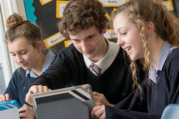 Jamf School is a purpose-built mobile device management solution for schools. Student using mobile device