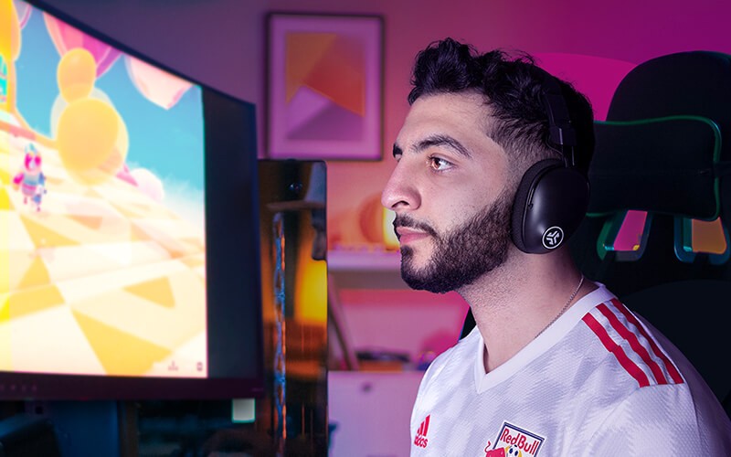 Headphones and kids headphones Man playing using JLab headphones