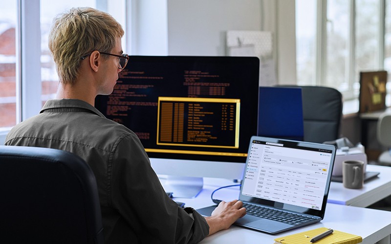 A zero-trust model protects critical data by requiring user verification before they access your network. IT using laptop