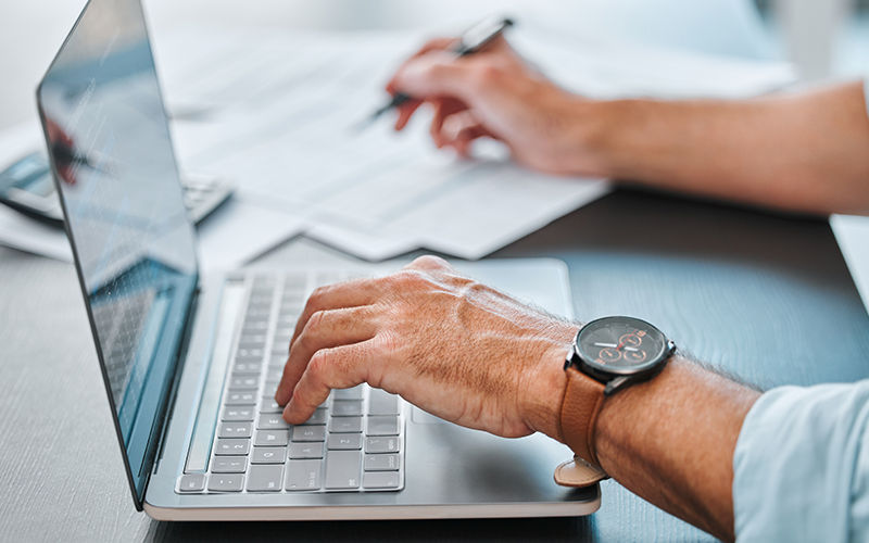Protect your organization from the No. 1 cause of breaches. Man working using his laptop