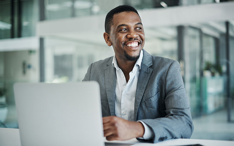 Compliance Plus Training Man working at the office