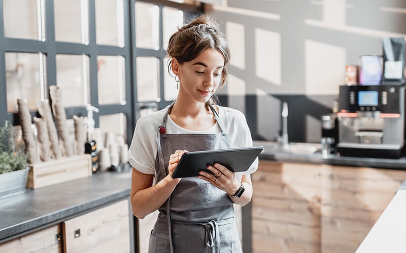LastPass enterprise solutions Woman using a tablet at work