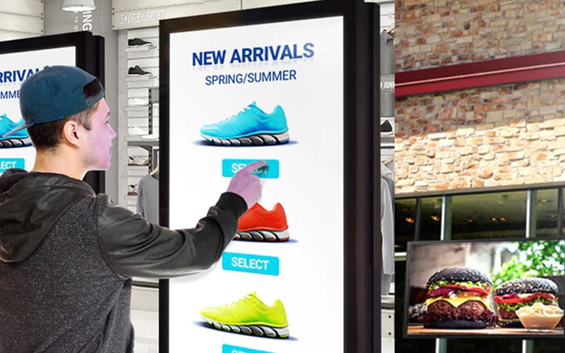 You’ll enable engaging viewing experiences, both indoors and outdoors Man using a touch-screen monitor