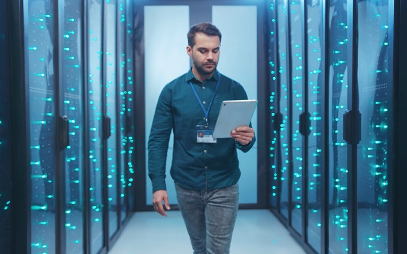 Derive real-time intelligence to uncover trends, patterns and relationship Professional holding a tablet