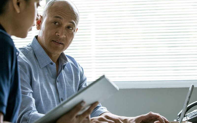 Microsoft Power BI lets your organization combine internal and external information Two professionals collaborating