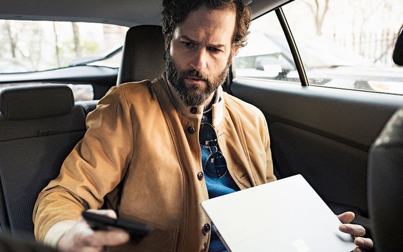 EMS is a cloud-based solution Man using Microsoft devices mobile