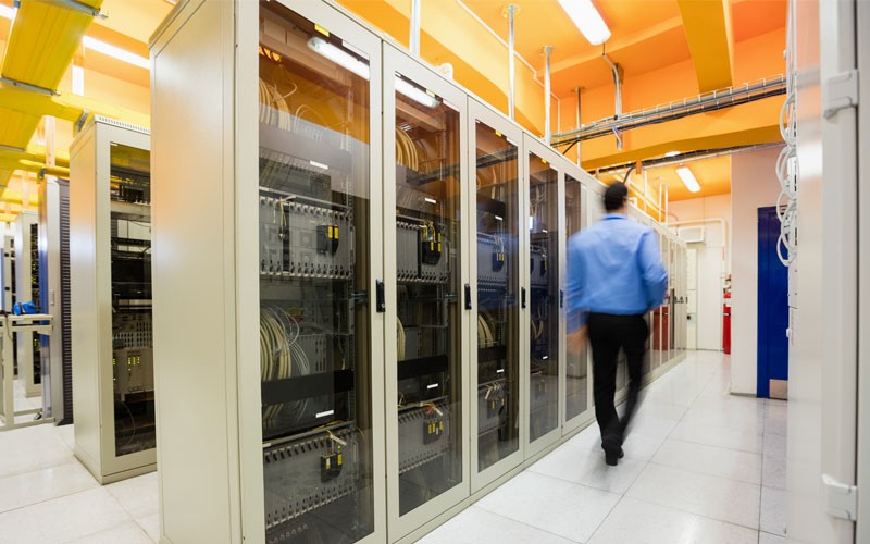 Man walking through data center