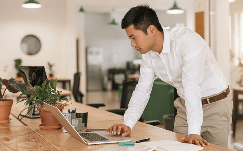 Manage social media & reviews in one hub Man working at the office