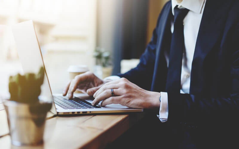 Nitro admin online administrative access that empowers a privileged user to set up or remove license keys remotely Business man typing on laptop keyboard