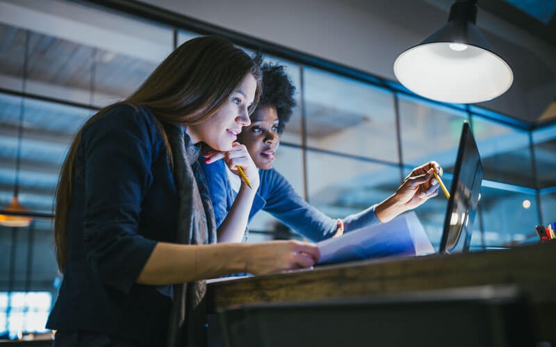 female-colleagues-working-together-revsersed female-colleagues-working-together-revsersed