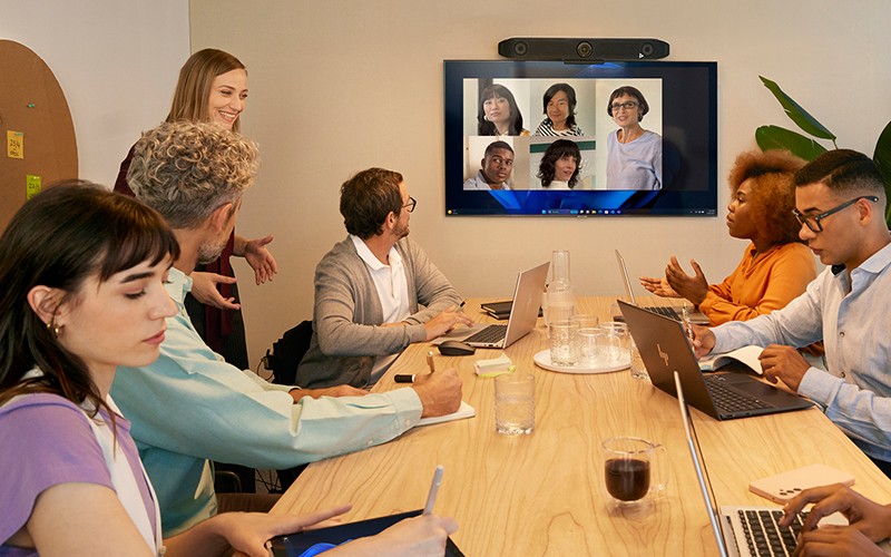 Poly videoconferencing solutions let you see every nuance Business man using Polycom video call