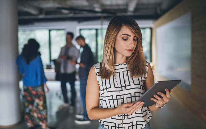 Quest performance monitoring Woman holding tablet in office