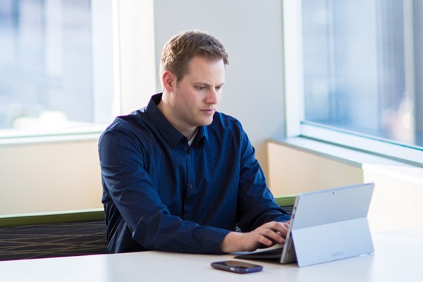 IT administrator using Microsoft Surface Pro with RSA's security portfolio