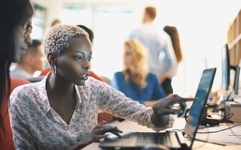 Coding best practices and industry standards Woman collaborating working on laptop