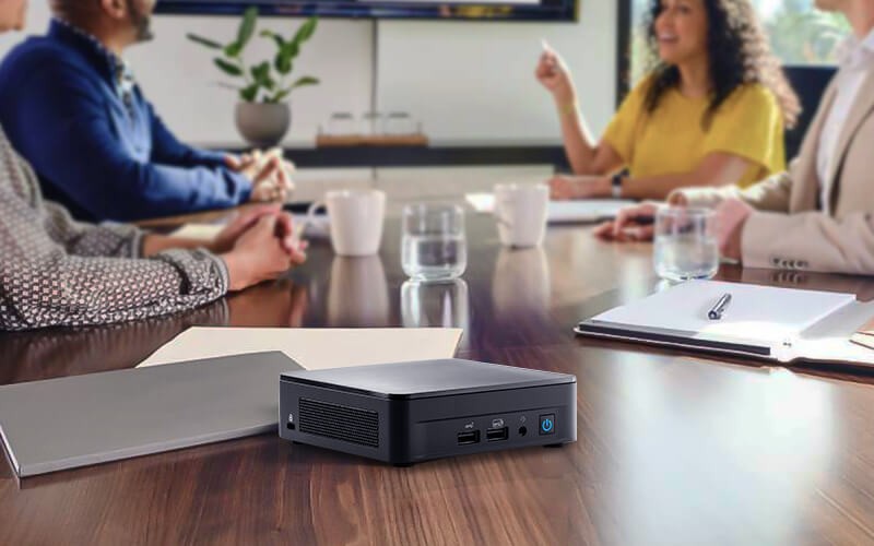 Meet Simply NUC. People having a meeting with NUC device