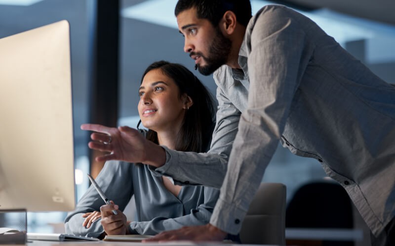 Count on Insight. Two person collaborating with each other