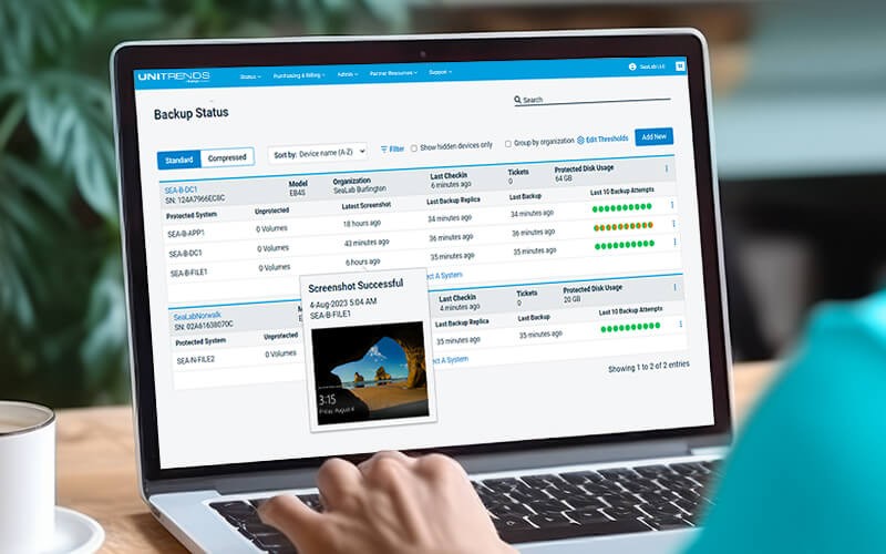 Endpoint backups Man working on laptop using Unitrends app