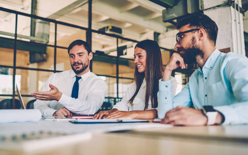 Nexmo The Vonage API Platform lets you create a scalable app Team working together in open office