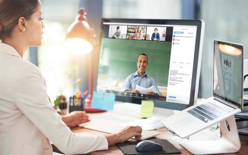 Zoom Meetings and Chat supports all your internal and external communications with video, audio and chat capabilities Woman having a meeting