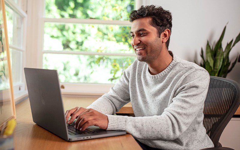 Get alerts to potential threats and ensure comprehensive security. Professional using laptop