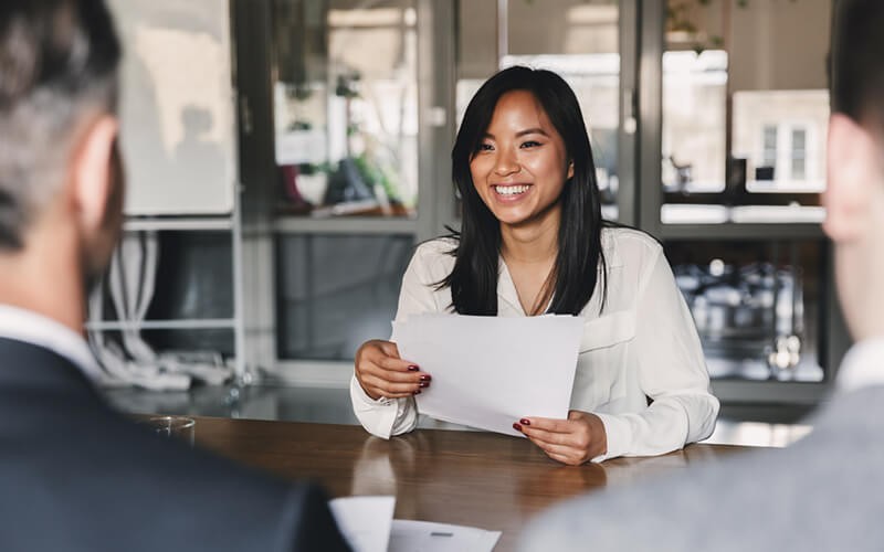 Deliver valuable products and adopt Agile processes Smiling businesswoman presents agile process plan to business