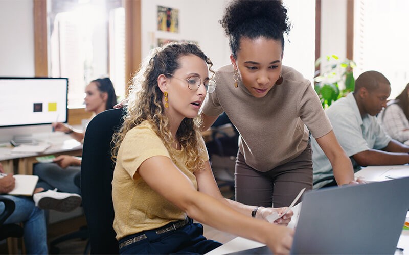 Respond to user feedback quickly Smiling woman on talking with colleague