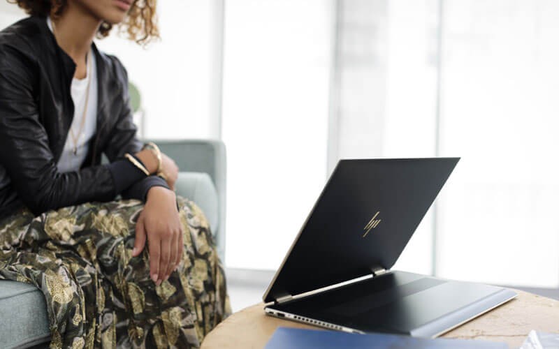 HP convertible notebook in office with female user